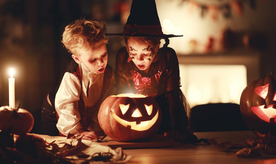 happy children in costumes of witch and vampire in a dark house in halloween | Author: evgeny atamanenko