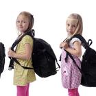 školarci nose teške torbe